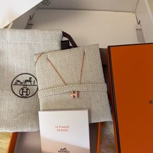 Hermes mini pop h necklace in pink with rose gold chain.